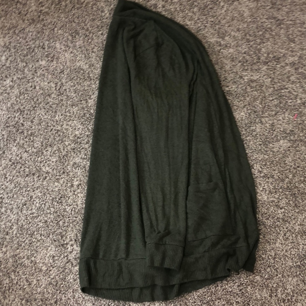This is a green sweater that is from market spruce and wasn’t worn